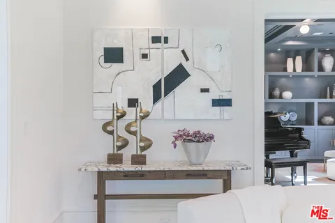 a view of living room with furniture and wooden floor