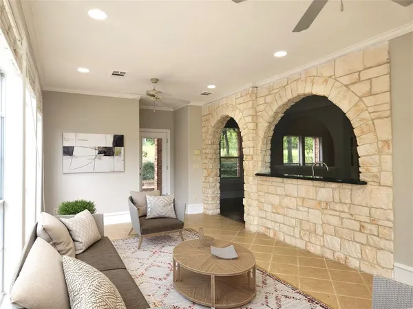 a living room with a couch and a fireplace