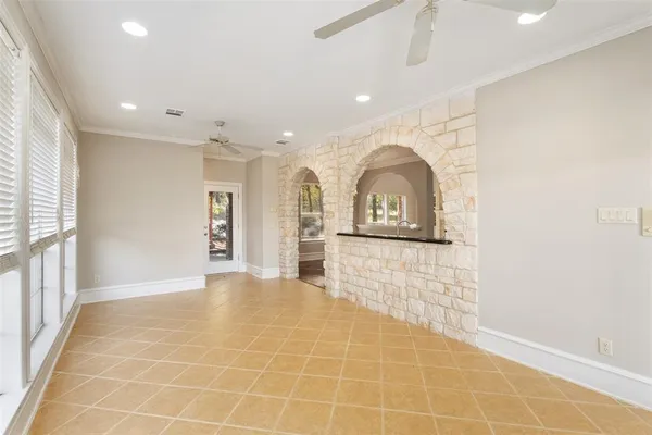 a view of a livingroom with wooden floor and window