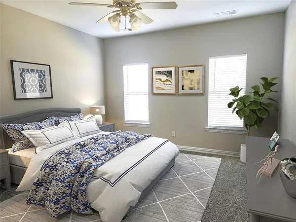 a bedroom with a large bed and a chandelier