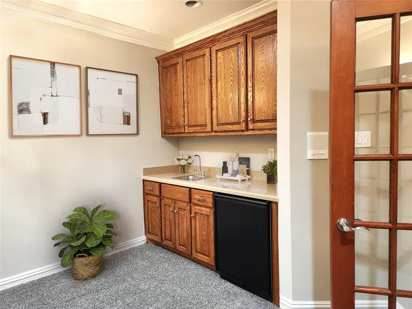 a view of cabinets with window and wooden floor