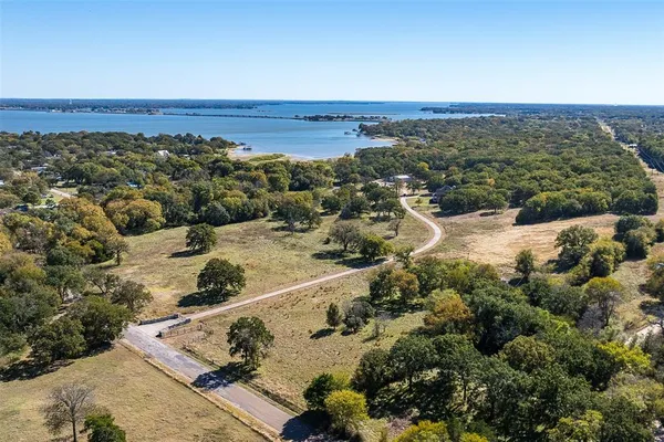 an aerial view of a house with a ocean view