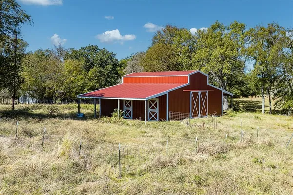 a house with trees in front of it