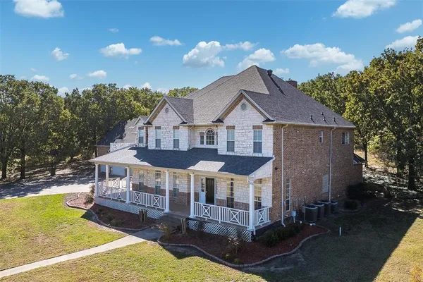 a view of a house with pool and chairs