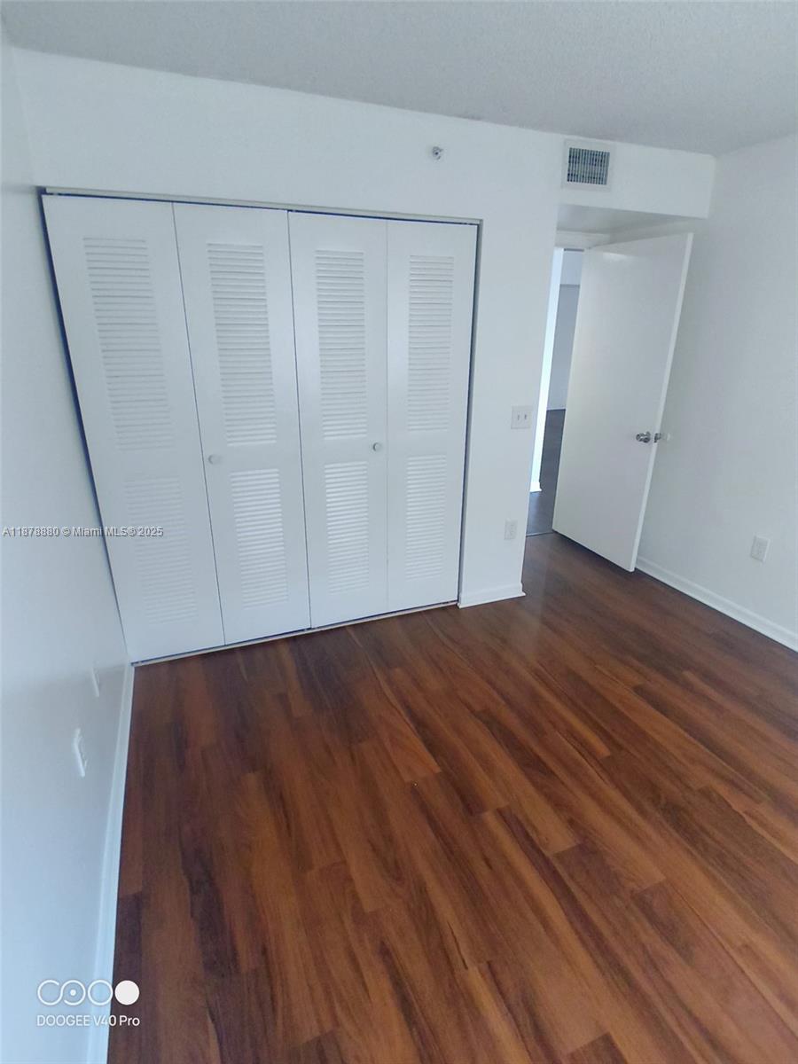 4183 Haverhill Road, Unit 712 West Palm Beach, FL 33417 - Photo 4 of 11 a view of a room with wooden floor
