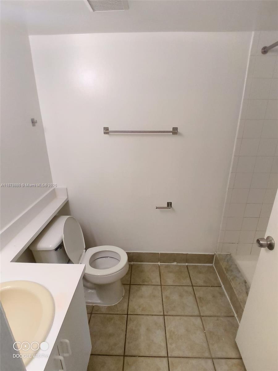 4183 Haverhill Road, Unit 712 West Palm Beach, FL 33417 - Photo 6 of 11 a bathroom with a sink and a toilet