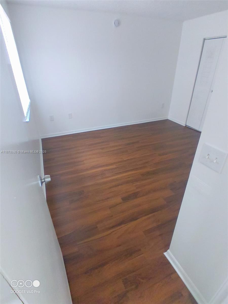 4183 Haverhill Road, Unit 712 West Palm Beach, FL 33417 - Photo 10 of 11 a view of wooden floor