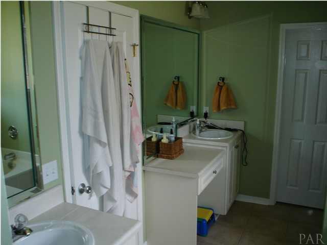 7157 Woodside Road Pensacola, FL 32526 - Photo 12 of 16 His and Hers vanities for your own space.