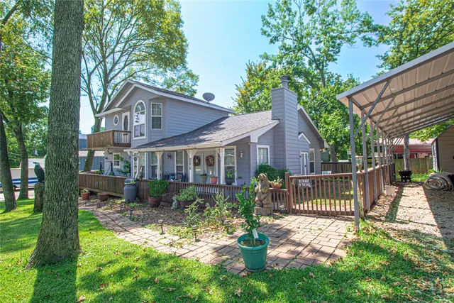 a front view of a house with a yard patio and fire pit