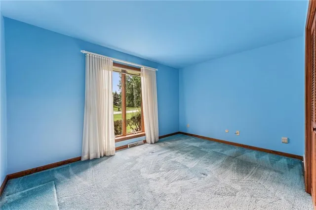 a view of a livingroom with furniture and white walls