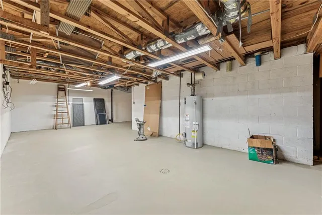 a view of a house with a big yard and sitting area
