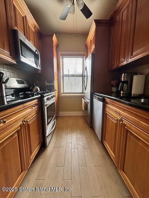 1000 Clove Road, Unit LO Staten Island, NY 10301 - Photo 8 of 13 a kitchen with granite countertop a sink a counter space cabinets and stainless steel appliances