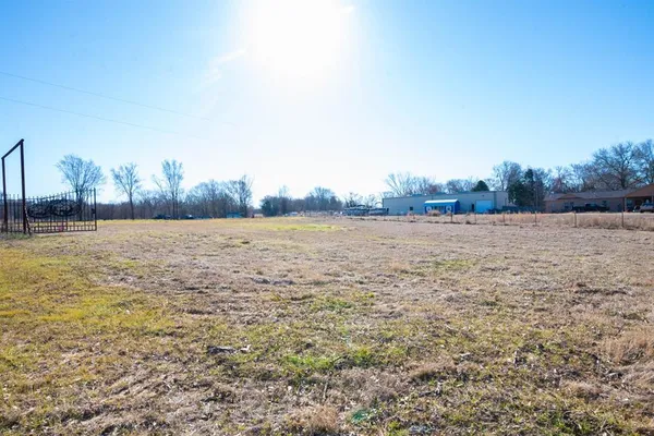 a view of a field with an outdoor space