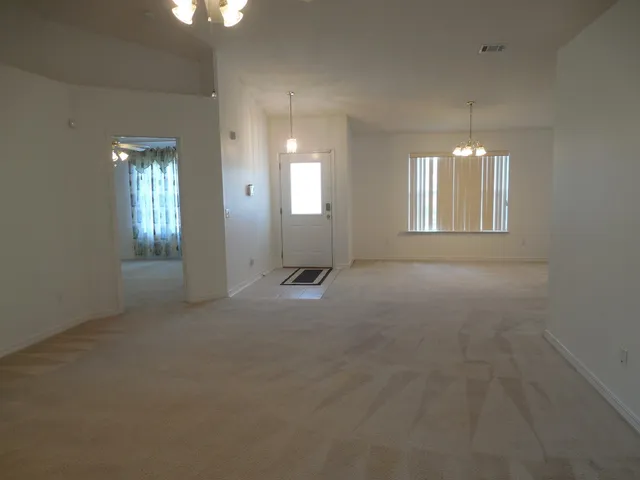 a kitchen with cabinets and white appliances