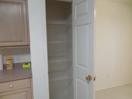 a kitchen with cabinets and window