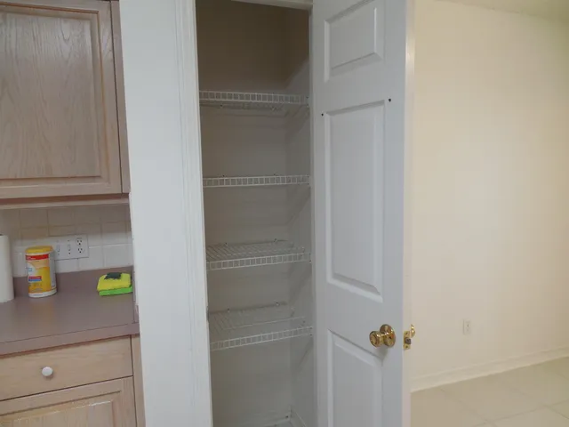 a kitchen with cabinets and window