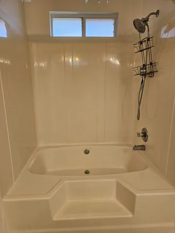 a view of an empty room with a window