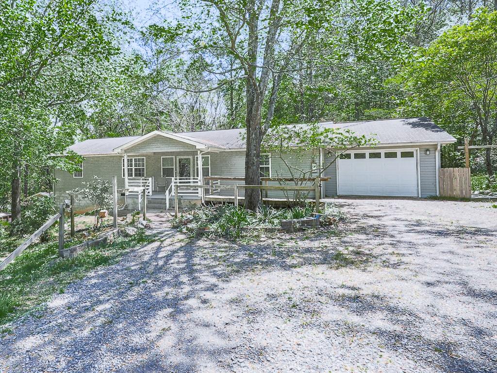 424 Shamrock Drive Dalton, GA 30721 - Photo 1 of 38 a front view of a house with a yard and large trees