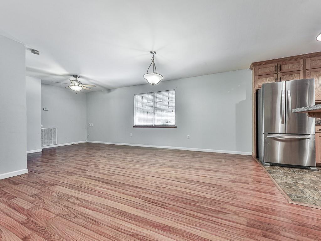 424 Shamrock Drive Dalton, GA 30721 - Photo 11 of 38 a view of a kitchen with a ceiling fan wooden floor and a ceiling fan