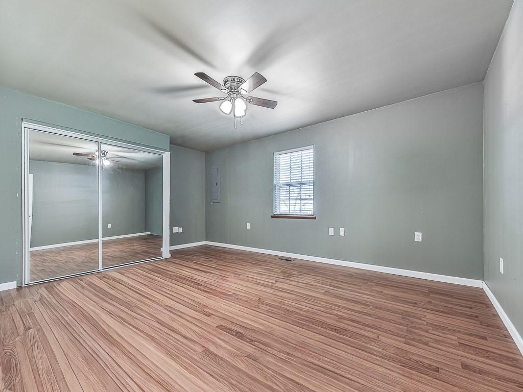 424 Shamrock Drive Dalton, GA 30721 - Photo 14 of 38 a view of an empty room with a window and wooden floor