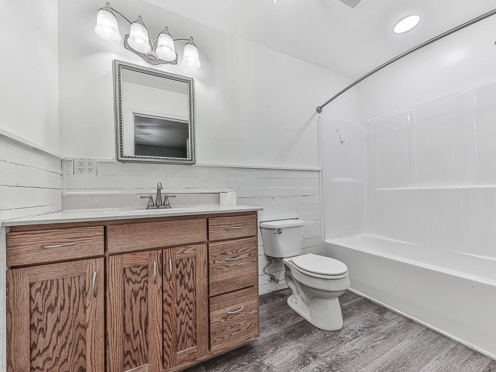 424 Shamrock Drive Dalton, GA 30721 - Photo 16 of 38 a bathroom with a toilet sink and mirror