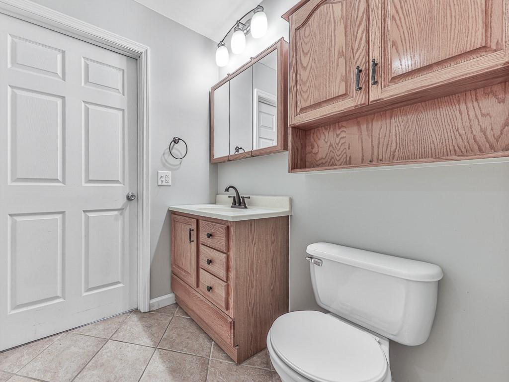 424 Shamrock Drive Dalton, GA 30721 - Photo 19 of 38 a white toilet sitting next to a bathroom sink