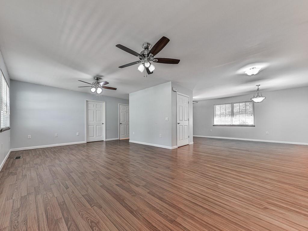 424 Shamrock Drive Dalton, GA 30721 - Photo 2 of 38 a view of an empty room with a window and wooden floor
