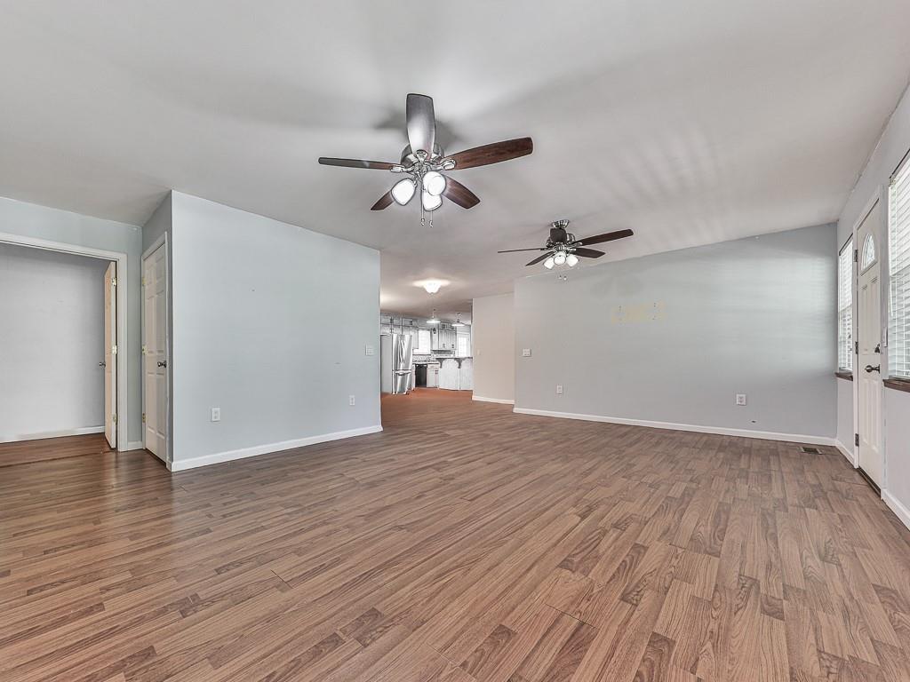 424 Shamrock Drive Dalton, GA 30721 - Photo 8 of 38 a view of empty room with wooden floor and ceiling fan