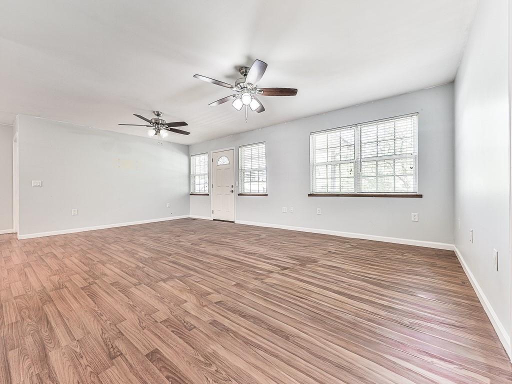 424 Shamrock Drive Dalton, GA 30721 - Photo 9 of 38 a view of empty room with wooden floor and fan