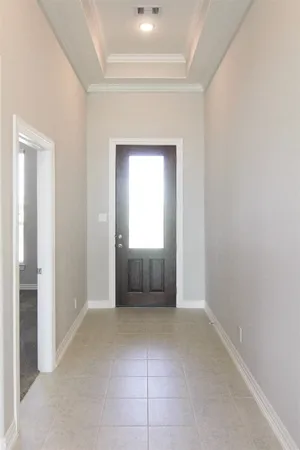 an empty room with a bathroom and a sink
