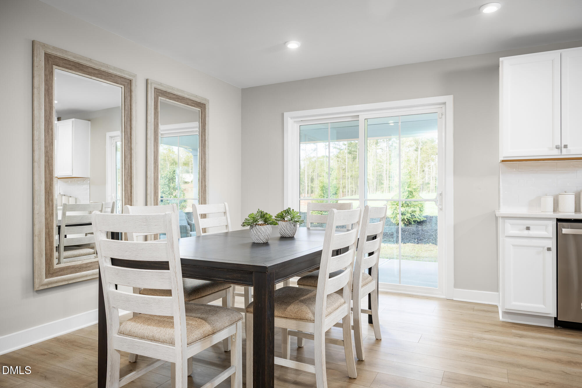 239 Country Side Way Fuquay-Varina, NC 27526 - Photo 5 of 15 a view of a dining room with furniture and wooden floor