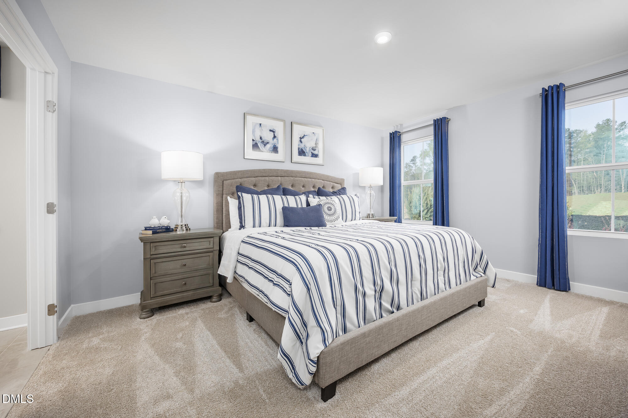 239 Country Side Way Fuquay-Varina, NC 27526 - Photo 9 of 15 a bed sitting in a bedroom next to a window