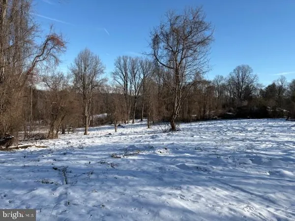 a view of a yard covered with snow in the yard