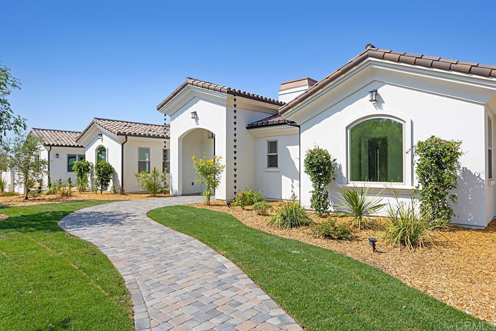5808 Lake Vista Drive Bonsall, CA 92003 - Photo 2 of 40 a front view of a house with garden