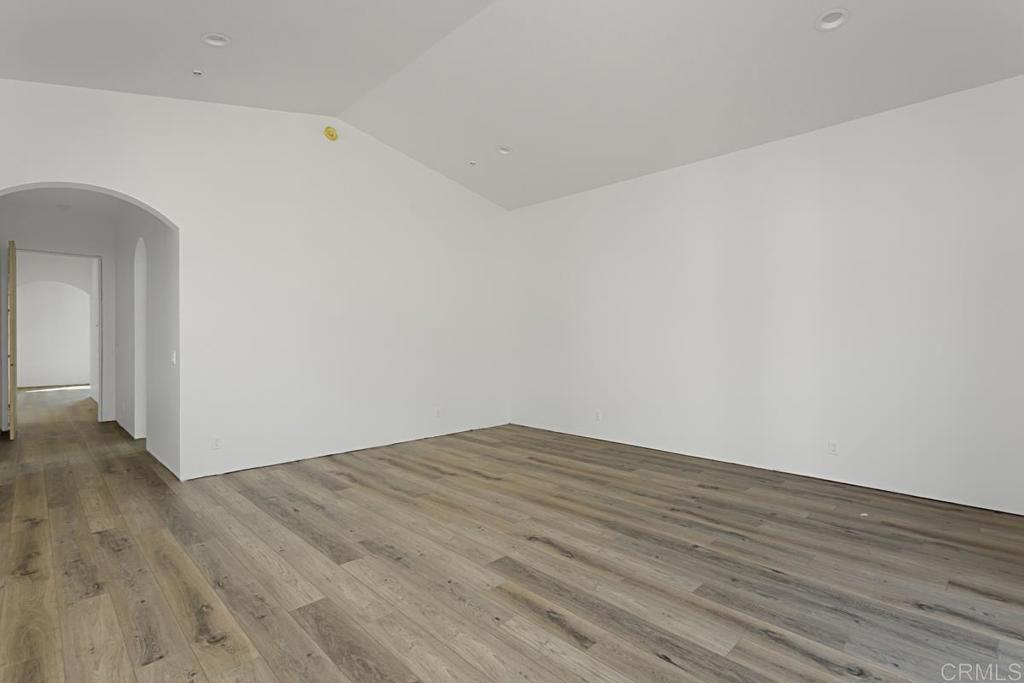 5808 Lake Vista Drive Bonsall, CA 92003 - Photo 23 of 40 a view of an empty room with wooden floor