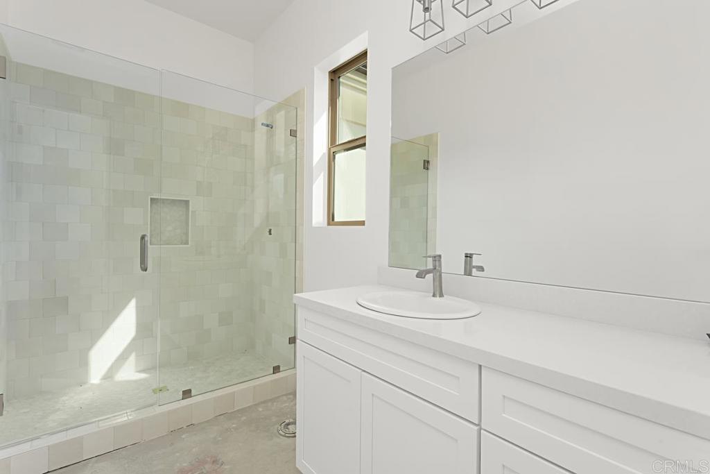 5808 Lake Vista Drive Bonsall, CA 92003 - Photo 26 of 40 a bathroom with a sink and a mirror