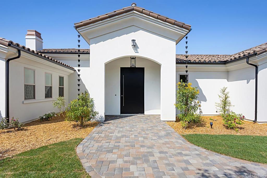 5808 Lake Vista Drive Bonsall, CA 92003 - Photo 3 of 40 a front view of a house with a yard
