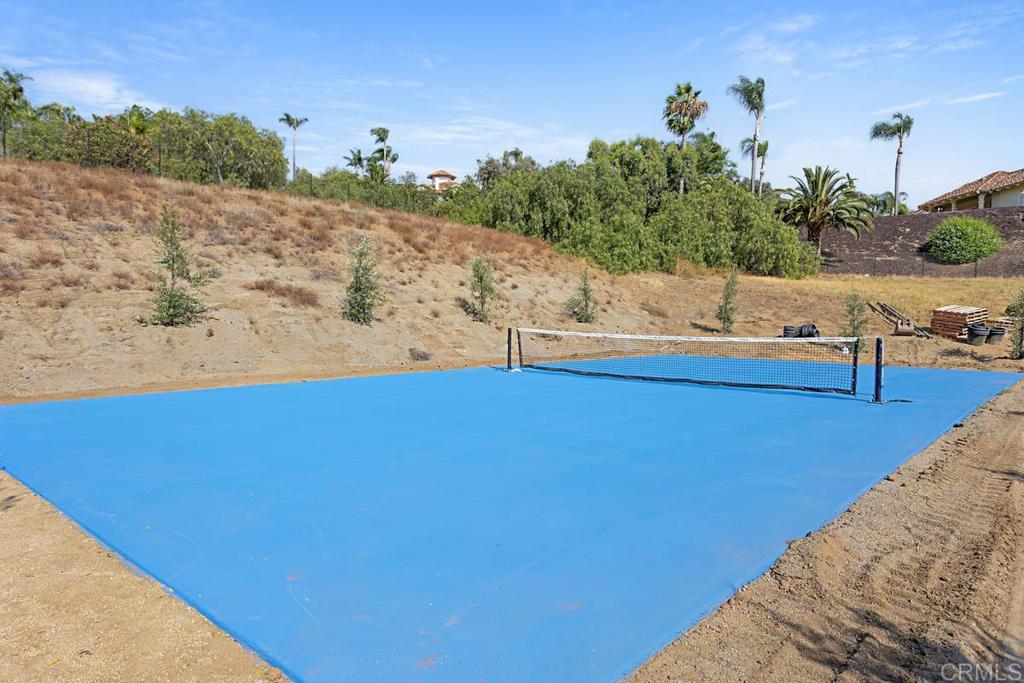 5808 Lake Vista Drive Bonsall, CA 92003 - Photo 35 of 40 a view of a swimming pool with an outdoor space and seating area