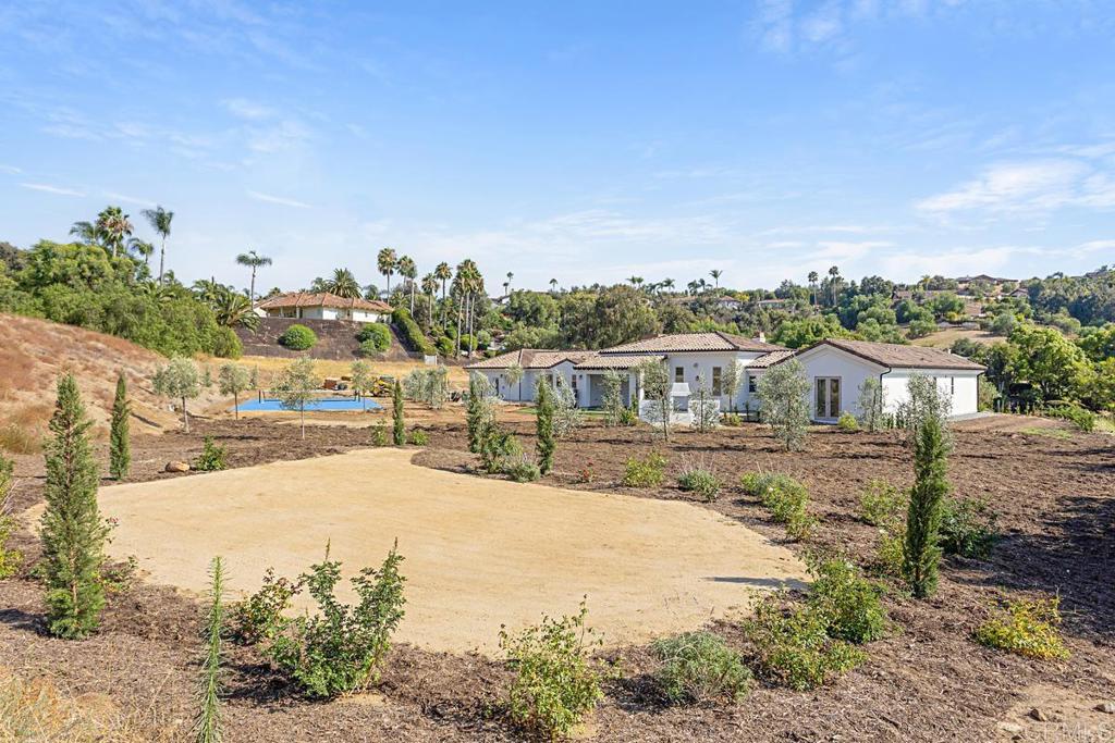 5808 Lake Vista Drive Bonsall, CA 92003 - Photo 36 of 40 a view of a house with a yard