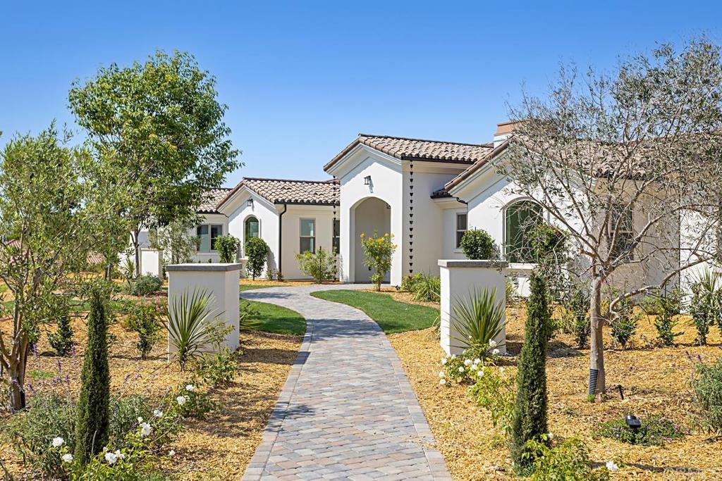 5808 Lake Vista Drive Bonsall, CA 92003 - Photo 38 of 40 a front view of a house with a yard and fountain