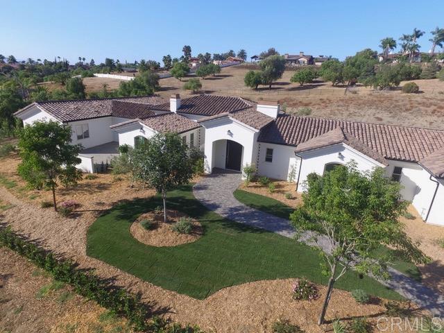 5808 Lake Vista Drive Bonsall, CA 92003 - Photo 40 of 40 a view of a house with a yard and potted plants