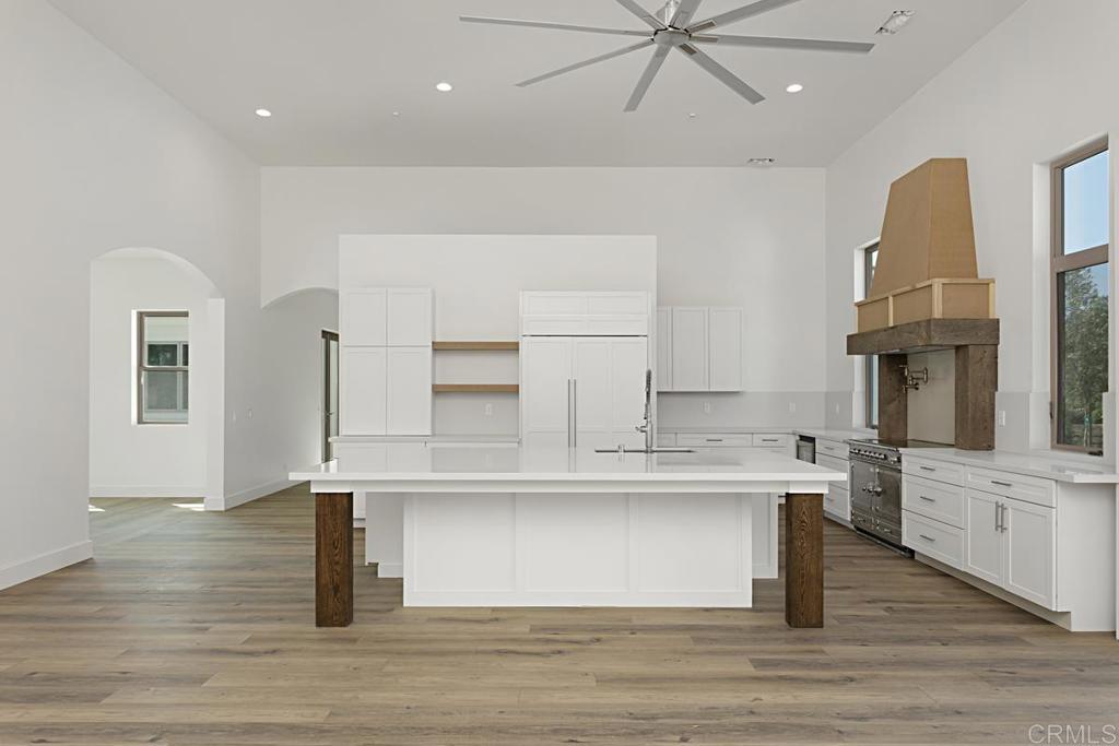 5808 Lake Vista Drive Bonsall, CA 92003 - Photo 8 of 40 a view of a kitchen with a sink stainless steel appliances and cabinets