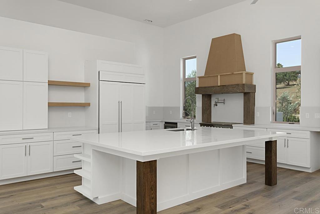5808 Lake Vista Drive Bonsall, CA 92003 - Photo 9 of 40 a kitchen with a sink cabinets and wooden floor