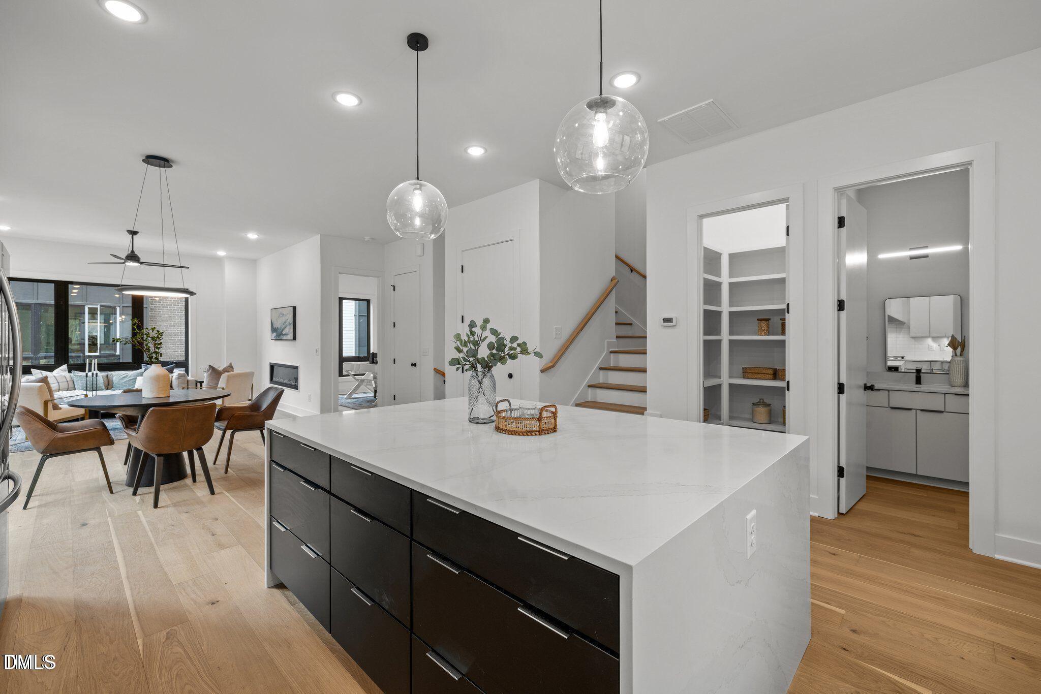 516 Edgecreek Court Raleigh, NC 27604 - Photo 14 of 26 an open kitchen with a table and chairs