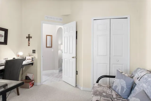 a bedroom with a bed and furniture