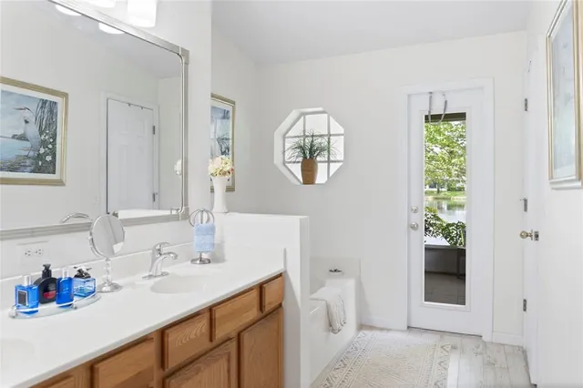 a bathroom with a sink and a mirror