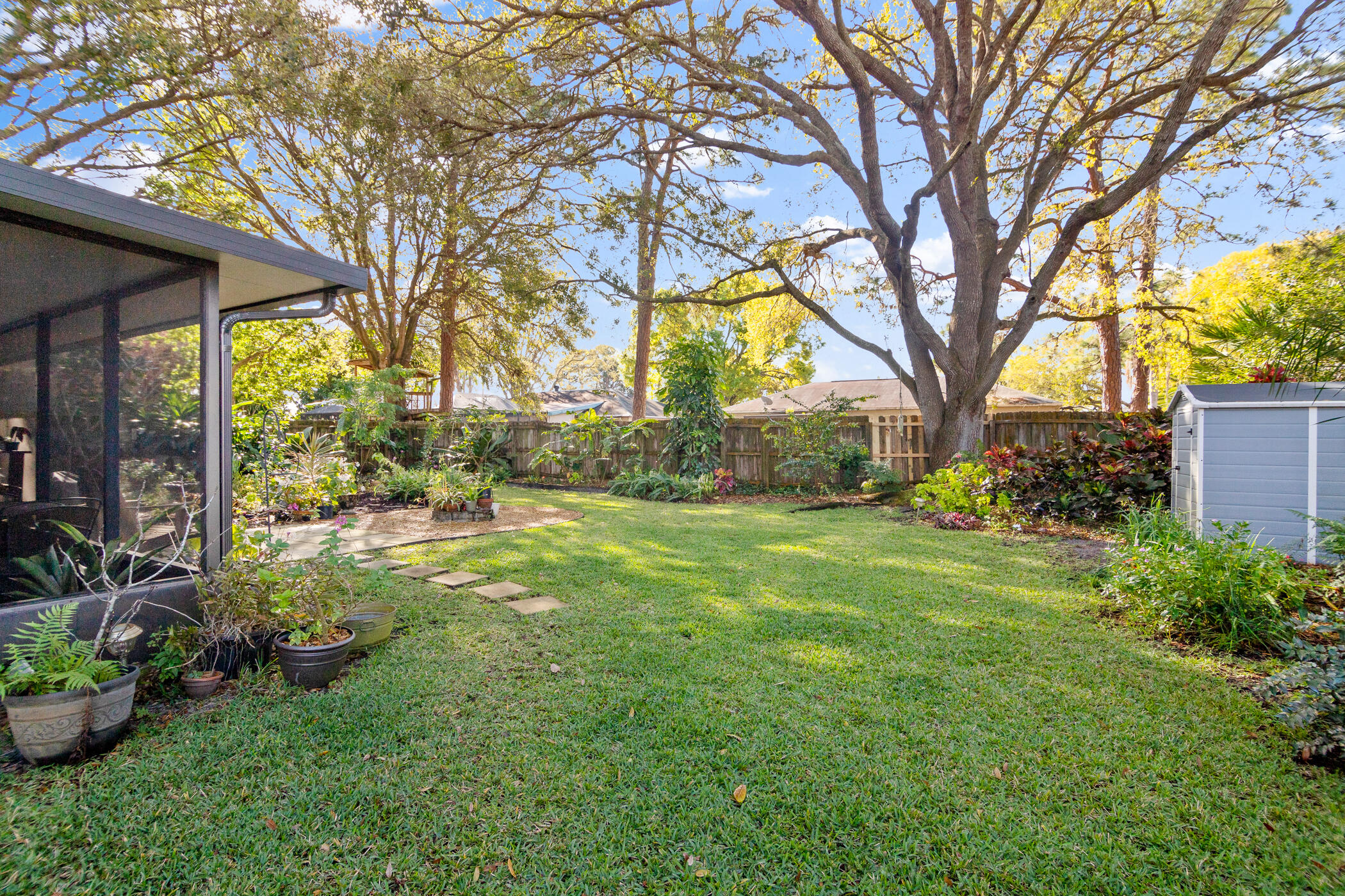 849 Gardener Road Rockledge, FL 32955 - Photo 24 of 31 a view of a garden with a tree