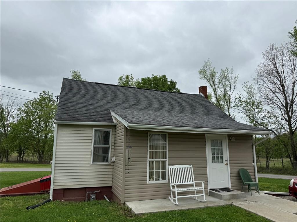 802 8th Street Mather, PA 15346 - Photo 1 of 27 a front view of a house with a garden