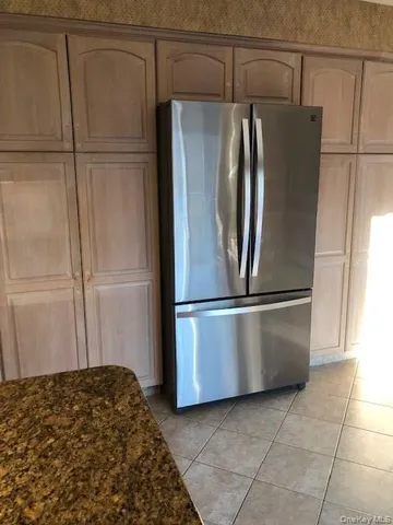 a view of empty room with window and fireplace