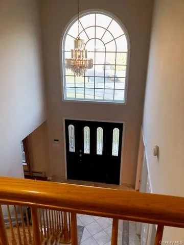 a view of room with window and wooden floor